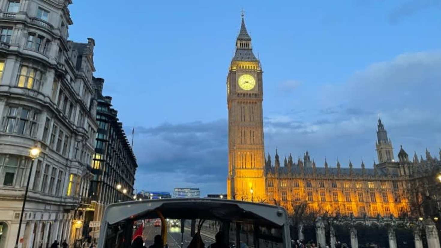 Big Ben and the Houses of Parliament illuminated at night from the Taylor Swift Singalong Bus Tour.