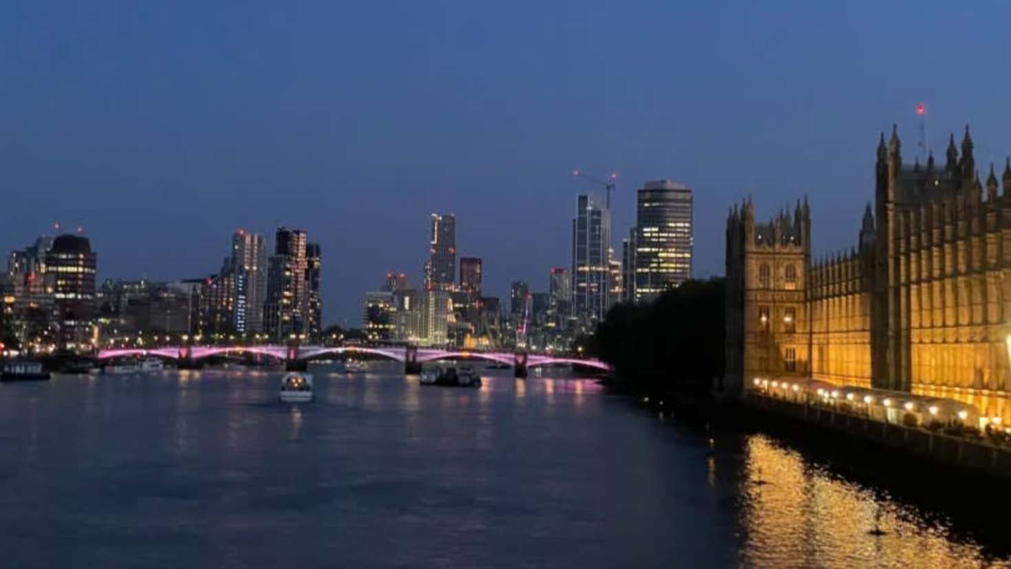 Night view of the River Thames, Westminster Bridge and London skyline from the Taylor Swift Singalong Bus Tour.
