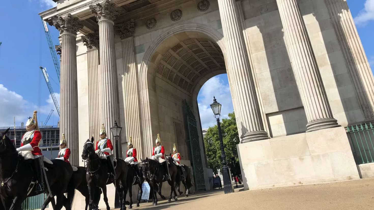 Close-up view of the changing of the Guard on horseback passing through Wellington Arch in London