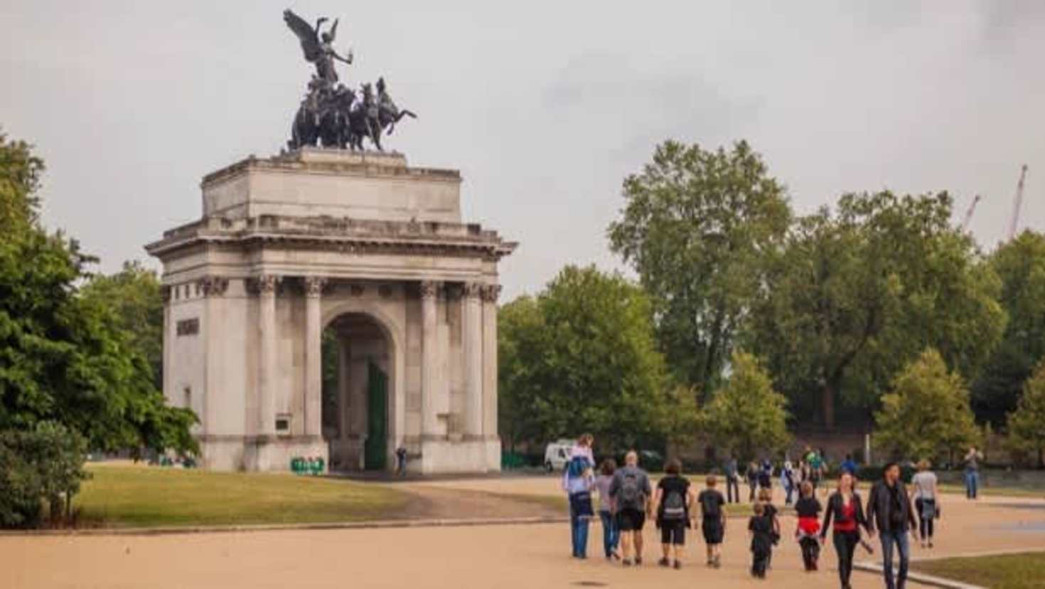 Families and visitors enjoying a day out at Wellington Arch in Hyde Park Corner