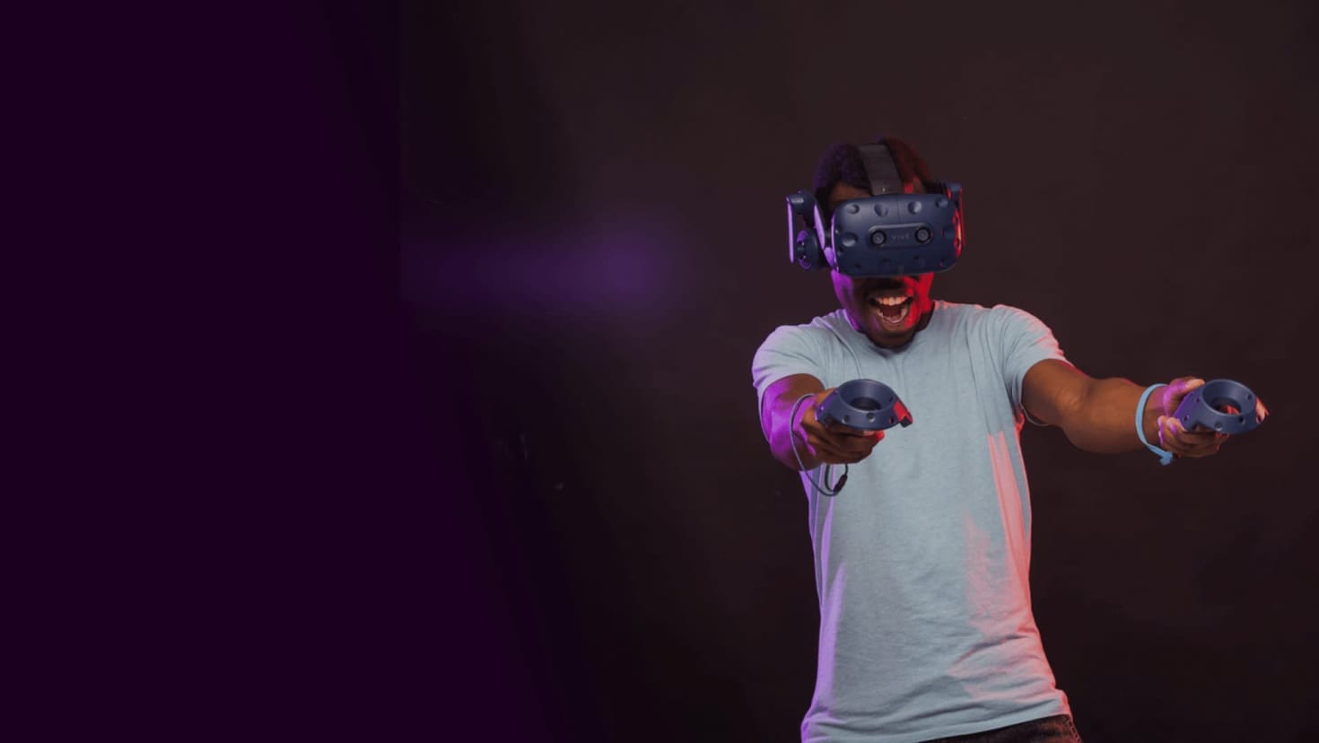 Player excitedly interacting with VR game using dual controllers at DNA VR Camden Player excitedly interacting with VR game using dual controllers at DNA VR Camden