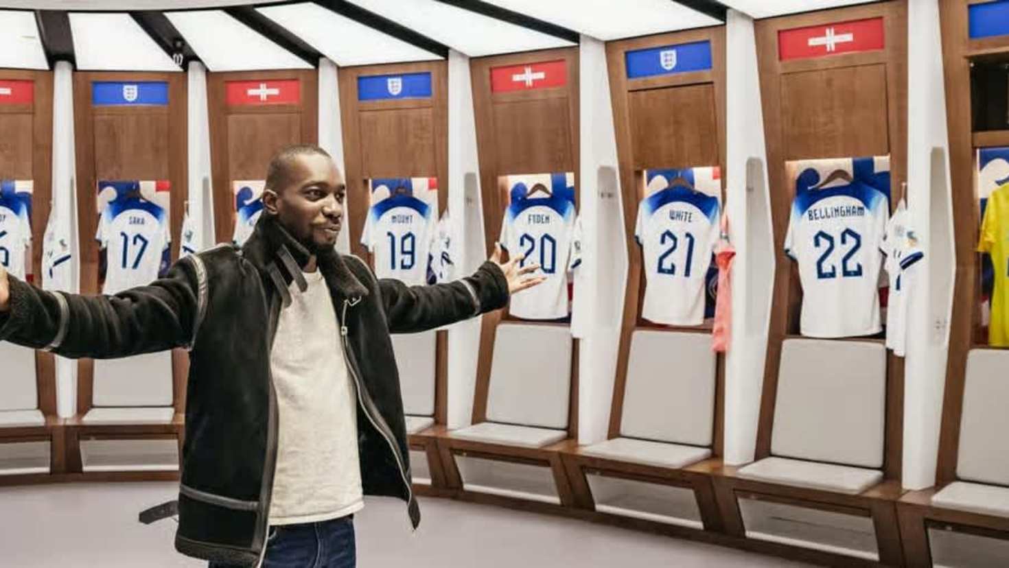 Man taking a picture in the England football teams's dressing room
