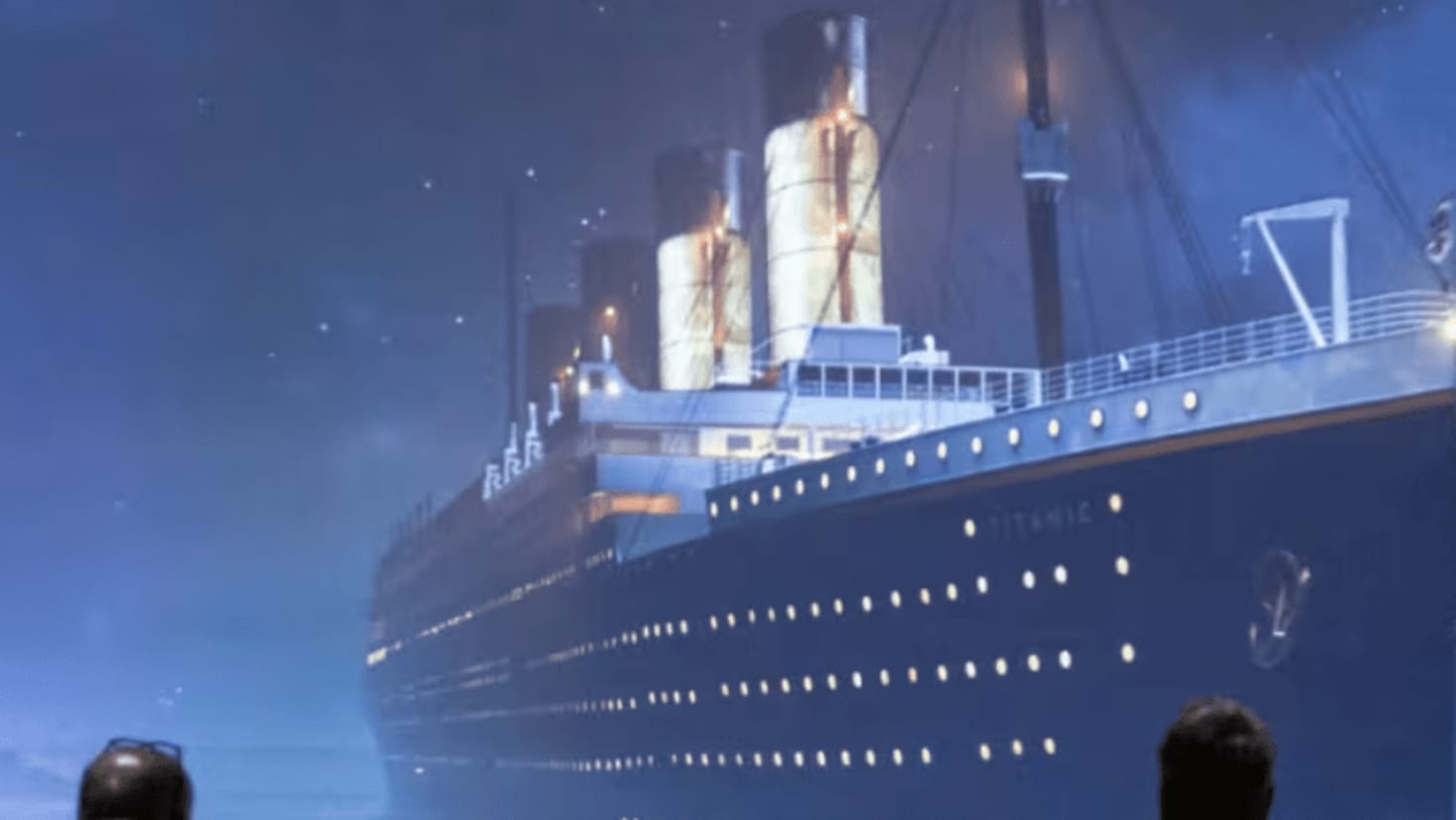 families onlooking at a visual of the iconic titanic ship families onlooking at a visual of the iconic titanic ship