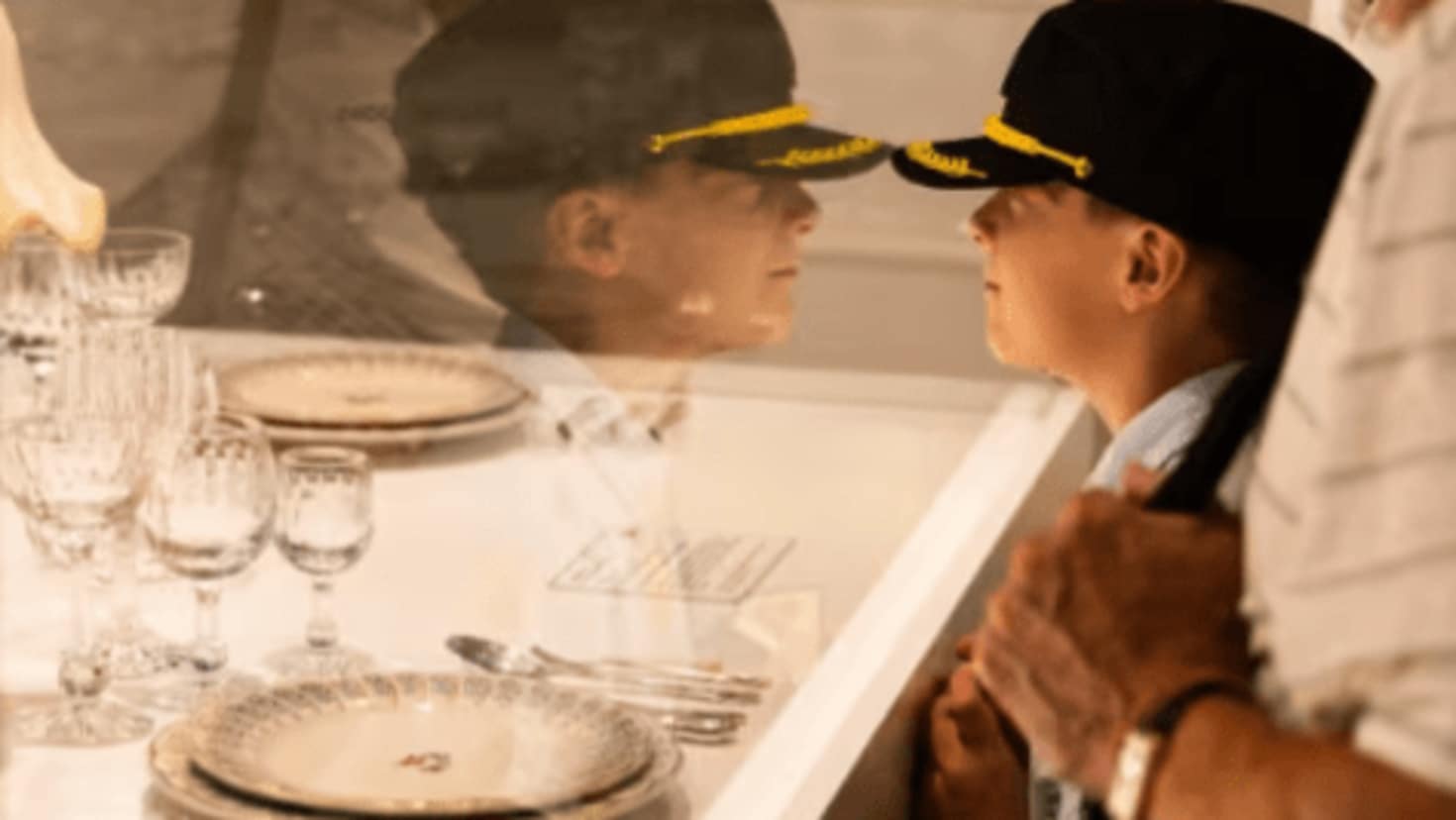 boy looking into a glass container full of historic artefacts boy looking into a glass container full of historic artefacts