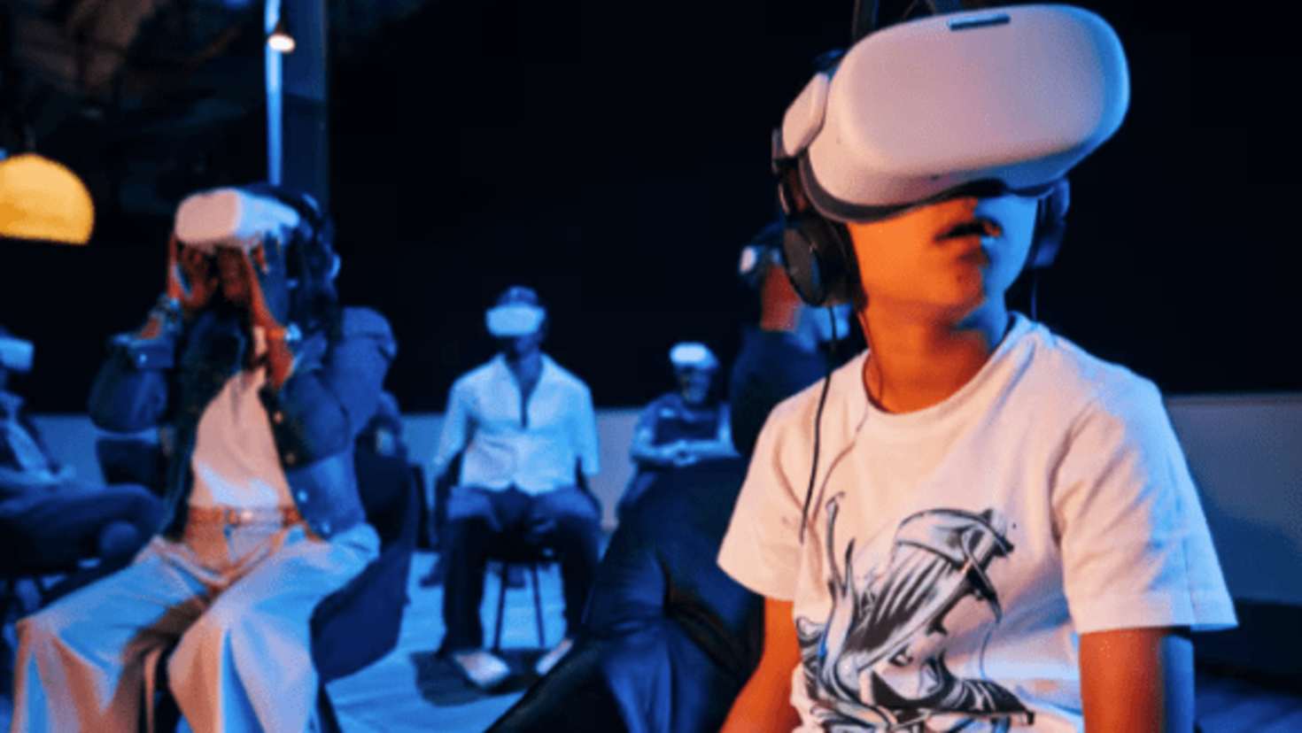 group sat with VR headsets on group sat with VR headsets on