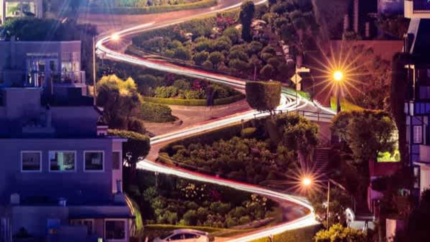 Steep winding street with sharp hairpin turns and flowers