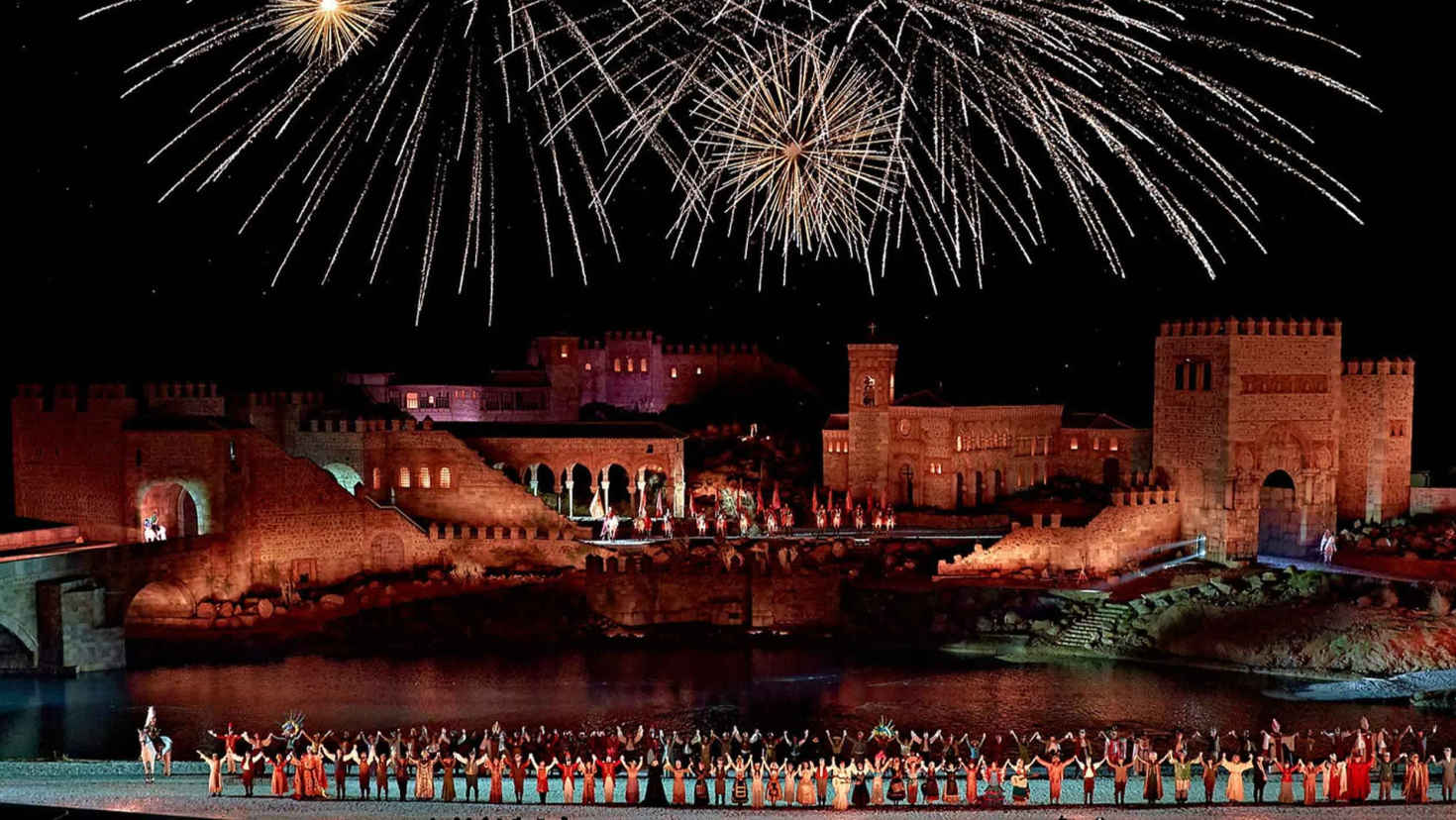 Large outdoor stage with performers and dramatic lighting during the night show Large outdoor stage with performers and dramatic lighting during the night show