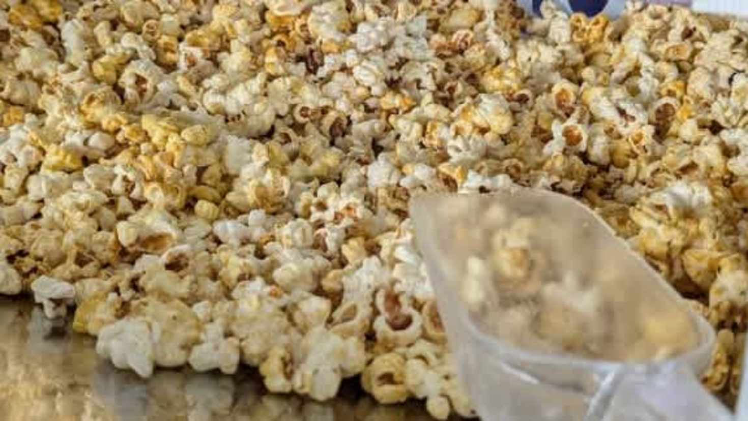 Fresh popcorn in a serving container Fresh popcorn in a serving container