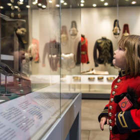 Boy in costume at The Household Cavalry Museum in London