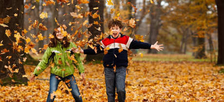 Kids playing with leaves at Supercamps in Shrewsbury