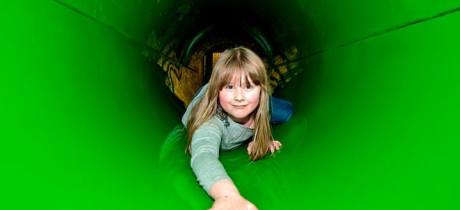 Girl in tunnel at Jungle Kids in Leeds