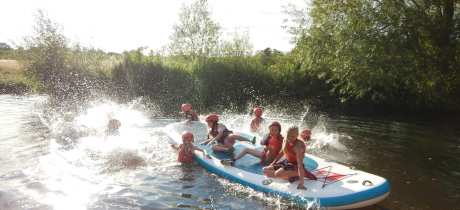 Kids rafting and in lake at Channel Adventure in Taunton