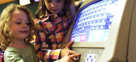 Kids touching score machine at Strikers at Fraserburgh Leisure Centre