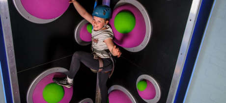 Girl climbing at Lakeland Climbing Centre in Kendal
