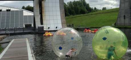 People water zorbing and dodgem boats at Outdoor Trax in Kilsyth