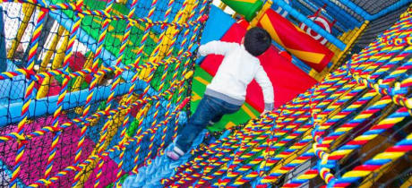 Boy on soft play frame at Teenie Weenies in Birmingham