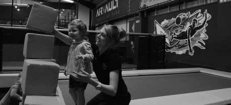 Girl playing with staff at AirVault Trampoline Park in Bolton