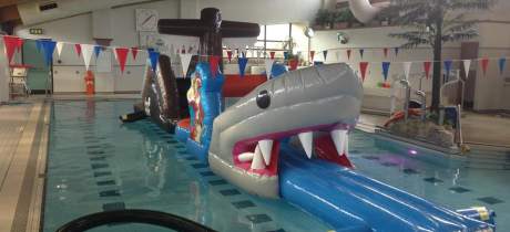 Inflatable assault course in swimming pool at Scalloway Pool in Shetland Isles
