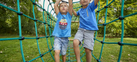 Kids on adventure playground at Sudeley Castle in Winchcombe