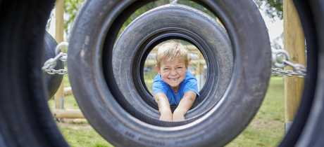 Boy on assault course at Sudeley Castle in Winchcombe