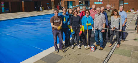 Volunteers by outdoor pool at Topsham Pool in Exeter