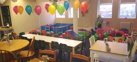 Dining tables and play area at The Little Play Cafe in South Shields