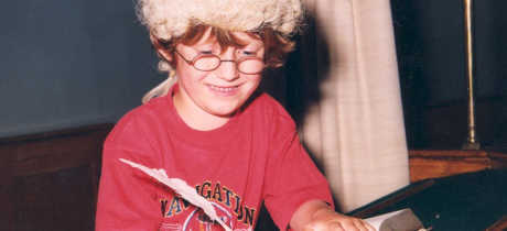 Boy wearing judge wig at The Judges Lodging in Presteigne