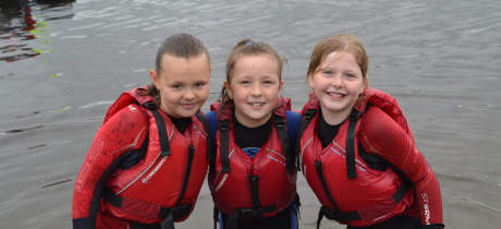 Girls in lake at Hollingworth Lake Activity Centre in Rochdale