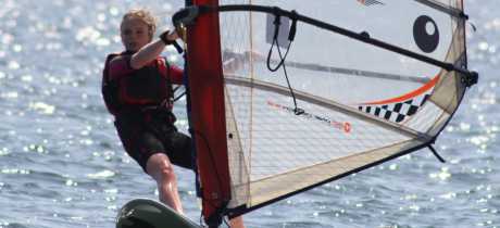 Girl wind surfing at Hollingworth Lake Activity Centre in Littleborough