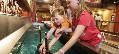Kids playing with model boat at Maritime Museum in Jersey
