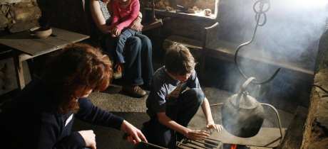 Family in historical room at Kirbuster Museum in The Orkney Isles
