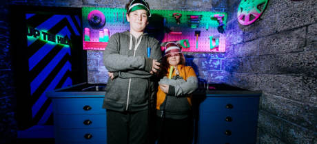 Two kids posing at Putt Club Crazy Golf in Hull