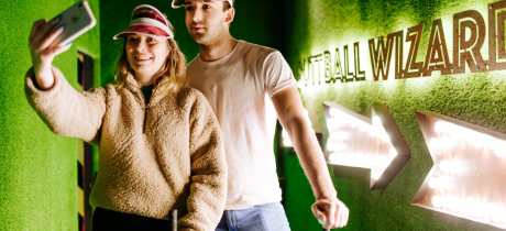 Two people taking a  photo at Putt Club Crazy Golf in Hull
