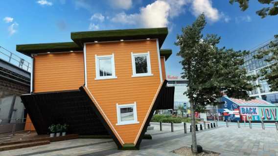 upside down brown house with Westfield shopping centre in the background
