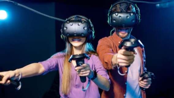 Two players enjoying an immersive multiplayer VR game at DNA VR Camden