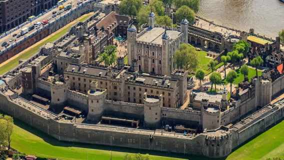View of the Tower of London from the River Thames on a sunny day