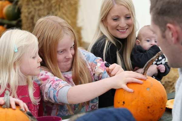 Family carving a pumpkin at Skylark Family carving a pumpkin at Skylark