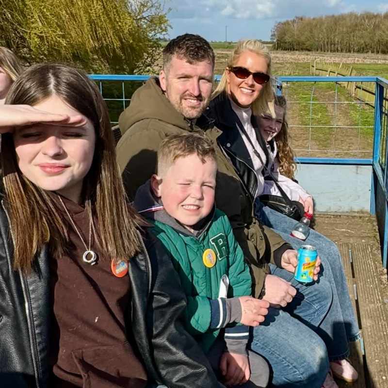 Proof that the sun did, in fact, make an appearance! Family photos were a challenge, but the smiles made it worthwhile.