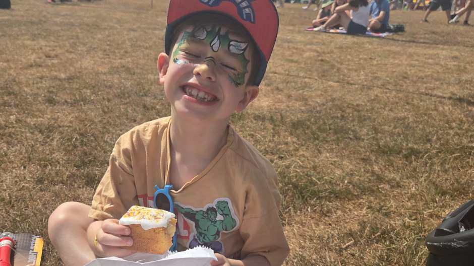 Olly enjoying the music and cake.