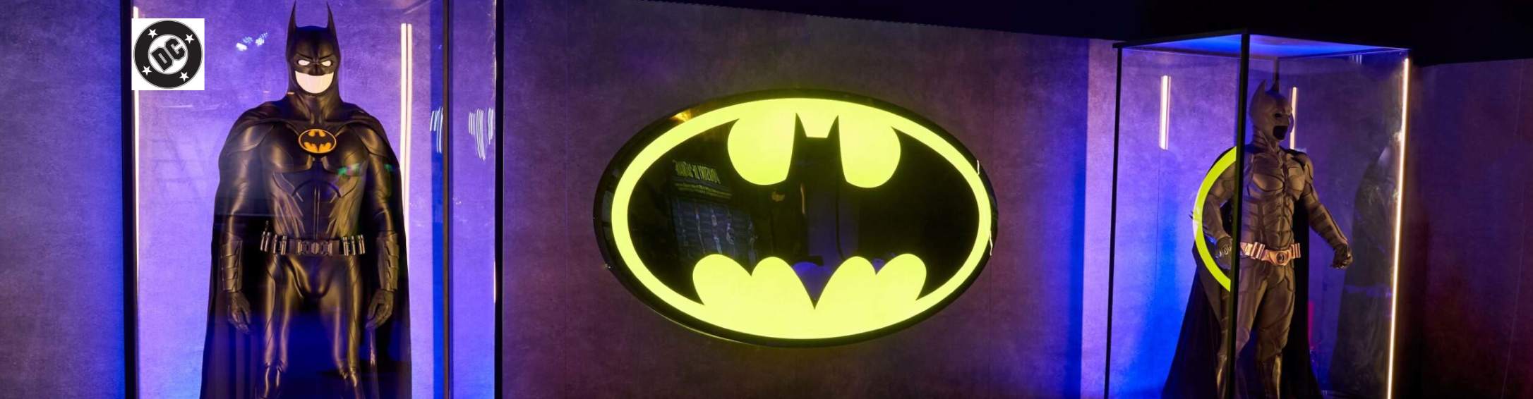 batman suits with neon batman sign in the middle 