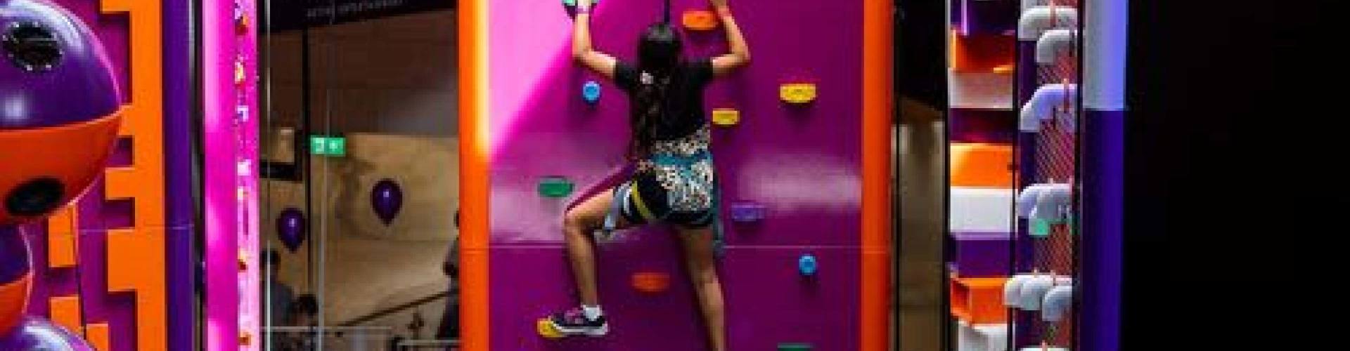 Girl climbing at Gravity