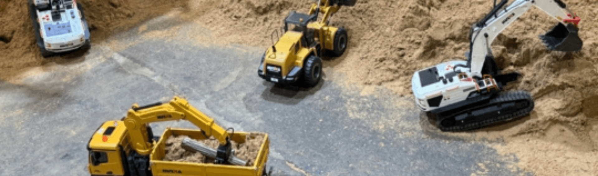 sandpit with miniature diggers 