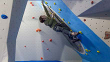 Boy on climbing wall at Avertical World Climbing Centre in Dundee