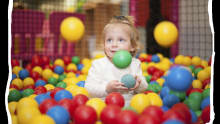 Girl in ball pit at Woodys Play Barn in Ware