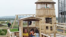 Kids on outdoor playground at Thurrock Thameside Nature Park in Stanford-le-Hope