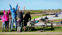 Family watching race at St Eval Kart Circuit in Wadebridge