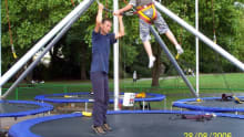 Dad and son on trampoline at Extreme Motion in Windsor