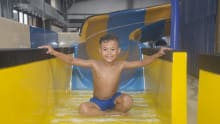 Boy on slide at Gulliver's Splash Zone Milton Keynes