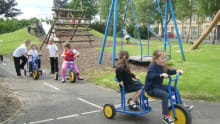 Kids on bikes at Reidvale Adventure Play in Glasgow