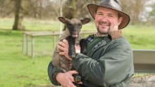 Staff holding lamb at Northycote Farm and Country Park in Wolverhampton